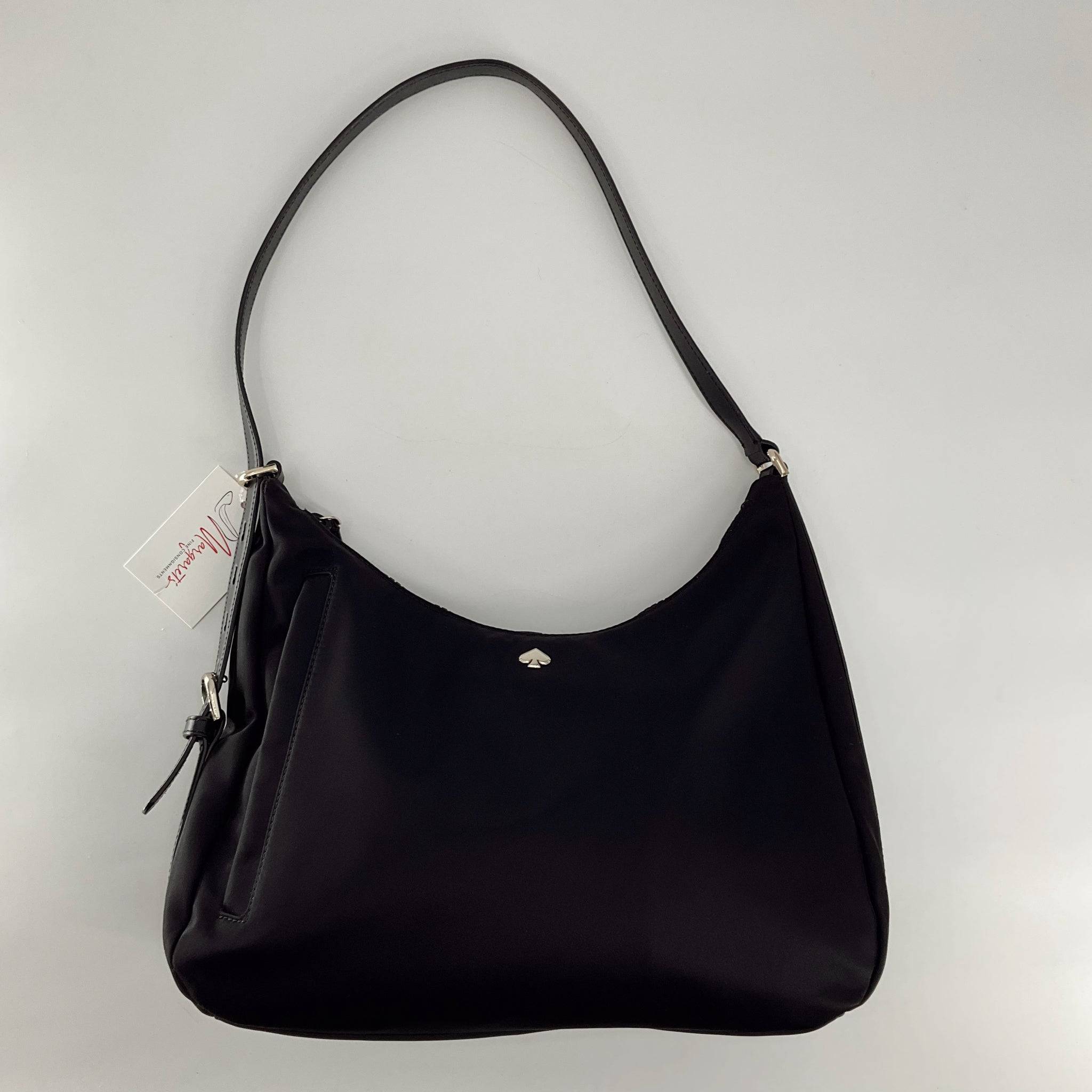 Kate Spade Black Solid Purse with shoulder strap and minimalist design, ideal for everyday use or formal occasions. Sleek black handbag with silver logo accent.