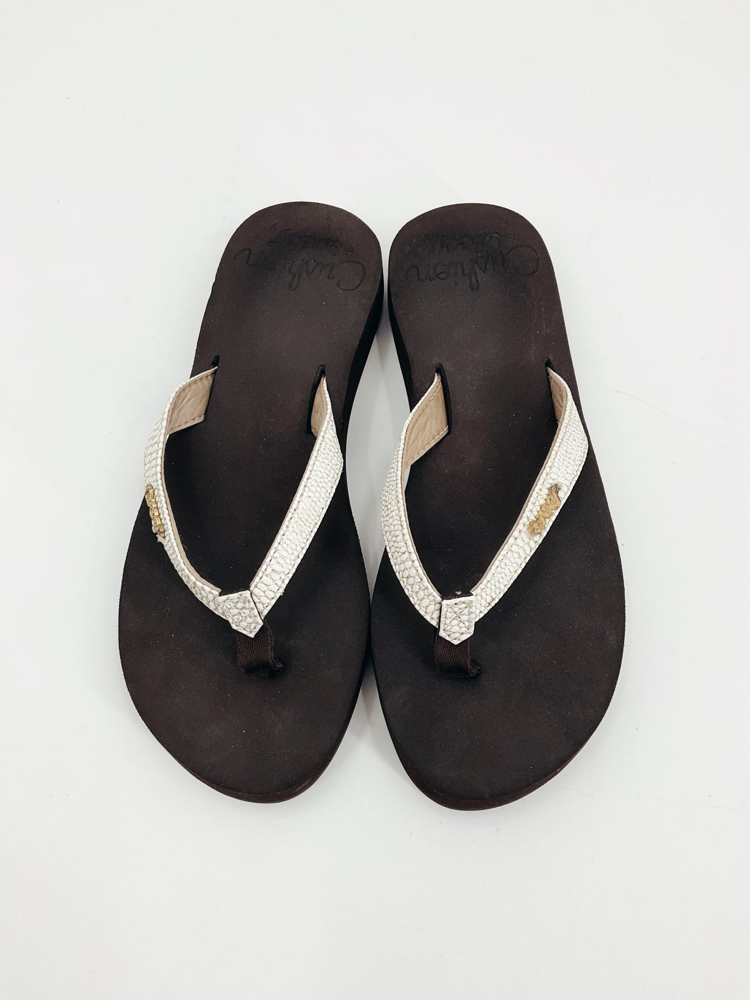 Brown and cream Reef ladies flip flop sandals in size 7, perfect for casual beachwear.