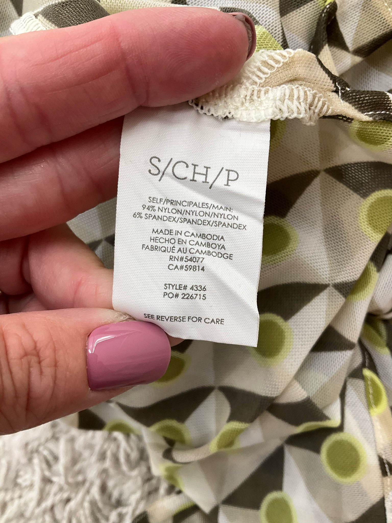 Cabi green and brown printed button-down blouse, collared long sleeve top, size small on a neutral background.