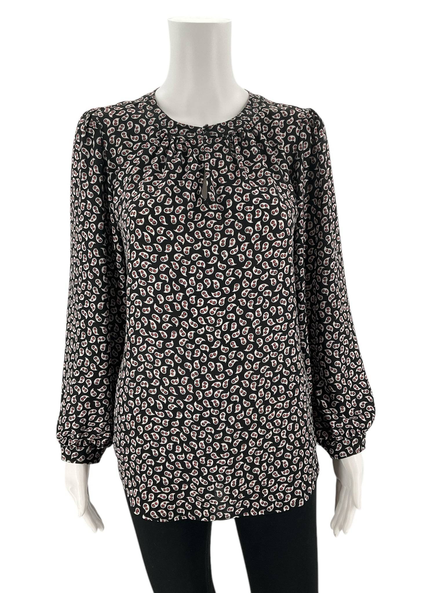 Front view of Loft Top Size Small at Margaret’s Fine Consignments; black, white, and red printed long sleeve blouse with gathered neckline detail.