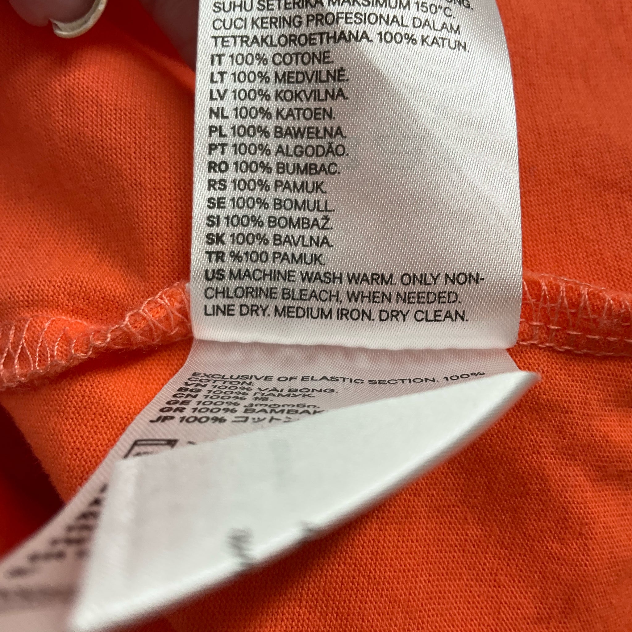 H&M orange cold shoulder top for women, size large, featuring a solid design and stylish cut.