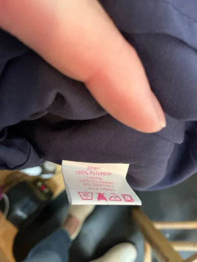 Navy Julie Brown ladies dress with butterfly print, size 4, displayed on a hanger against a neutral background.