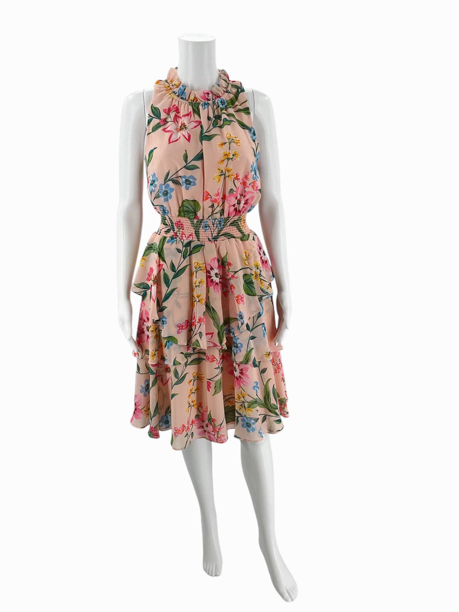 Eliza J blush floral crew neck mini dress size 8 with sleeveless design and ruffled neckline, available at Margaret’s Fine Consignments.