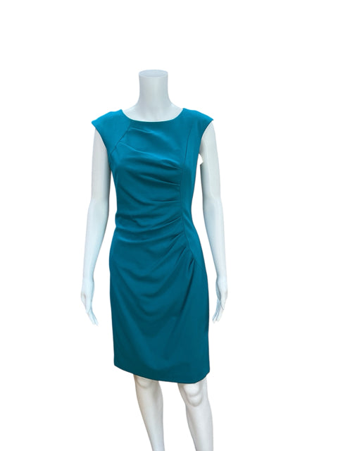 Front view of Calvin Klein teal bodycon dress, size 2, featuring a boat neck and ruched detailing, perfect for office or evening events.