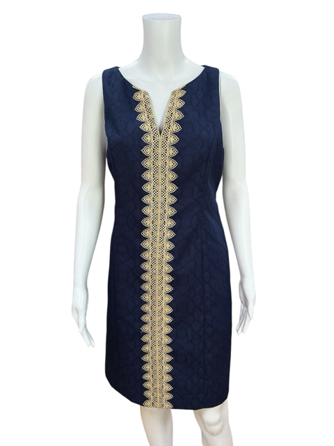 Front view of Cappagallo Navy/Gold Solid Pre-Owned Ladies Dress - Size 8 on mannequin, featuring elegant gold scalloped trim and jacquard texture.