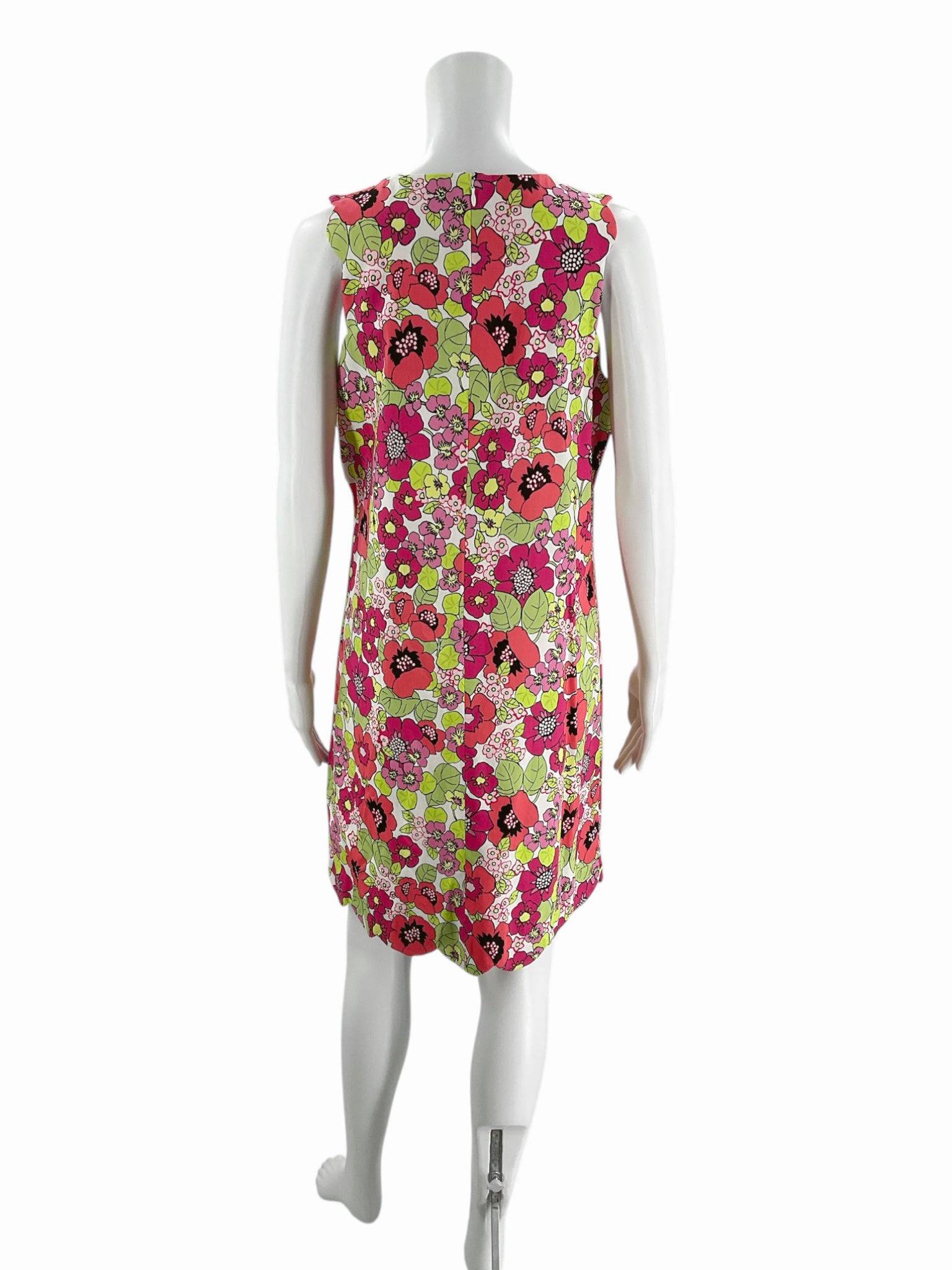 Back view of Cappagallo floral mini dress, sleeveless with vibrant coral, pink, and green pattern, size 10, from Margaret’s Fine Consignments.