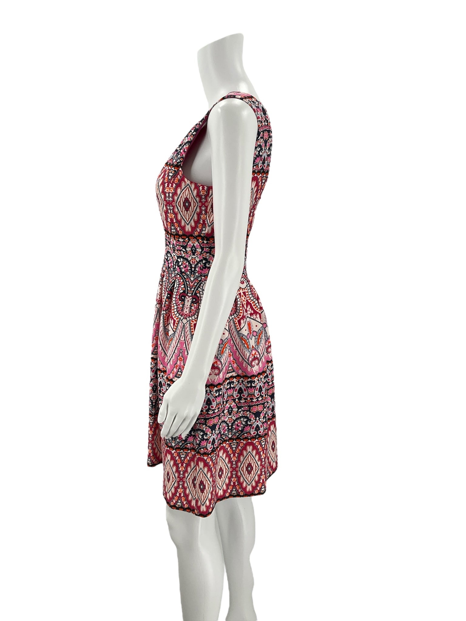 Side profile of Vince Camuto Pink/Navy/Orange Print Dress - Size 4 highlighting fitted waist and flared hem. Pre-owned dress with bold warm-weather print.