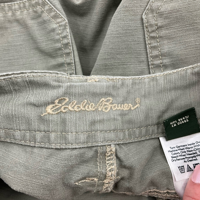 Close-up of Eddie Bauer logo stitched inside waistband of Olive Shorts - Size 8, showcasing brand authenticity.