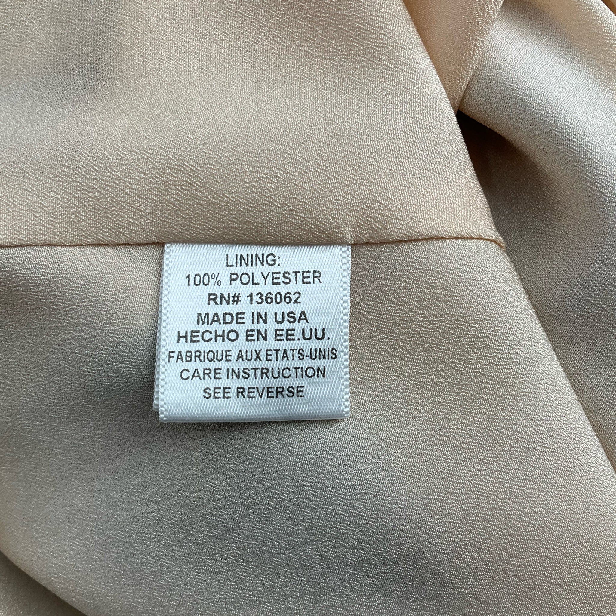 Inner lining tag of Lavender Brown Blue/Multi Floral Dress - Size Large, showing 100% polyester lining and made in USA label.
