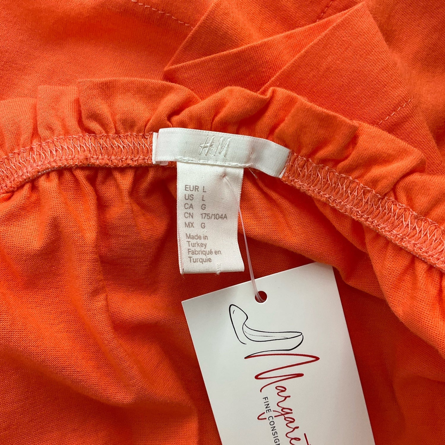 H&amp;M orange solid cold shoulder ladies top in size large, showcasing a stylish and casual design.