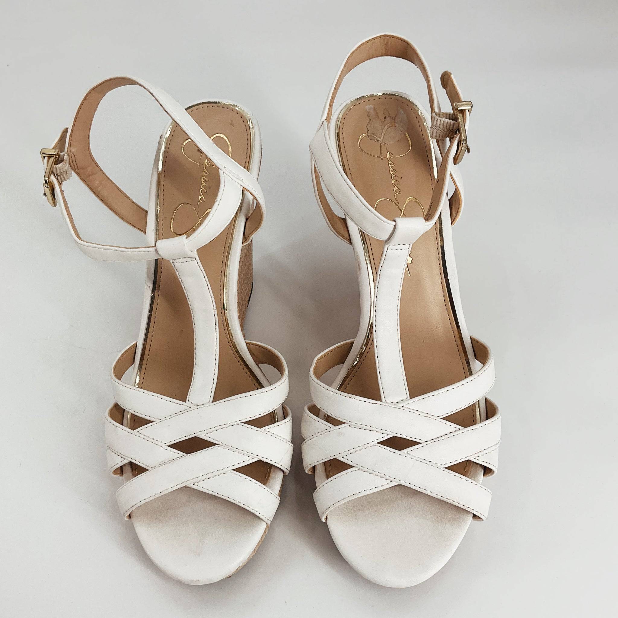 Top view of Jessica Simpson White Solid Pre-Owned Sandals - Size 7 featuring crisscross straps and cushioned insole, ideal for casual chic looks.