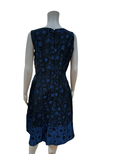 Back view of Anne Klein black and blue floral dress in size 10, highlighting the concealed zipper and tailored fit for a flattering silhouette.