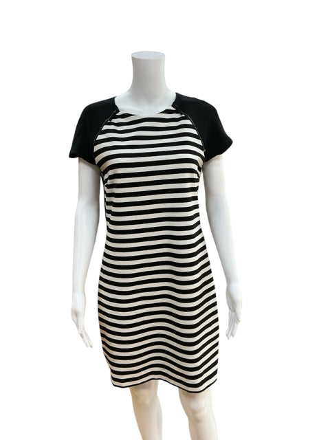Michael Kors Black/White Stripe Pre-Owned Ladies Dress Size 6 on mannequin. Colorblock cap sleeves and stretch knit fabric ideal for business casual wear.