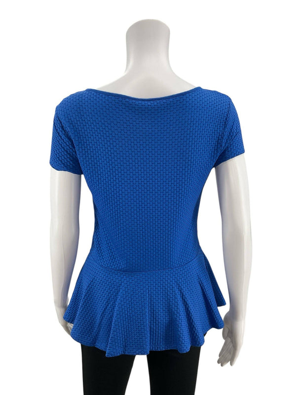 Back view of Loft Top Size Small in textured blue fabric with scoop neckline and flared hem, pre-owned at Margaret’s Fine Consignments.