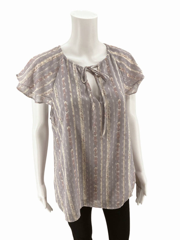Front view of L Love Lavender Floral Top Size Large featuring vertical floral stripes and flutter sleeves. Shop at Margaret’s Fine Consignments.