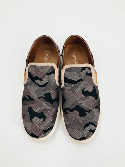 OluKai pink and black camo slip-on sneaker for women, showcasing a casual and comfortable coastal style in size 7/7.5.