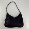 Kate Spade Black Solid Purse with shoulder strap and minimalist design, ideal for everyday use or formal occasions. Sleek black handbag with silver logo accent.