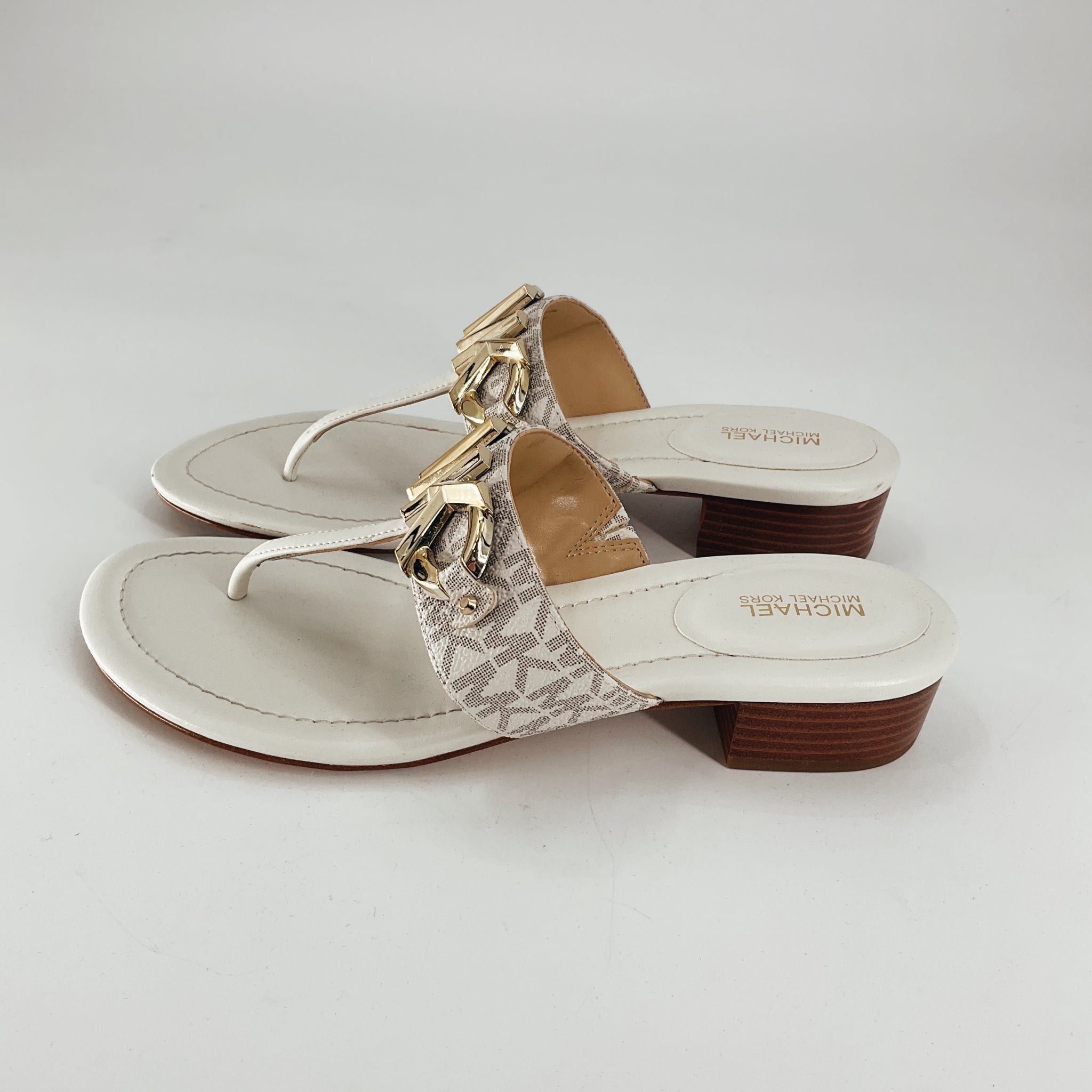 MK Cream Logo Flip Flop Sandals Size 8.5 with gold MK emblem and low wooden heel, perfect for stylish casual wear from consignment.