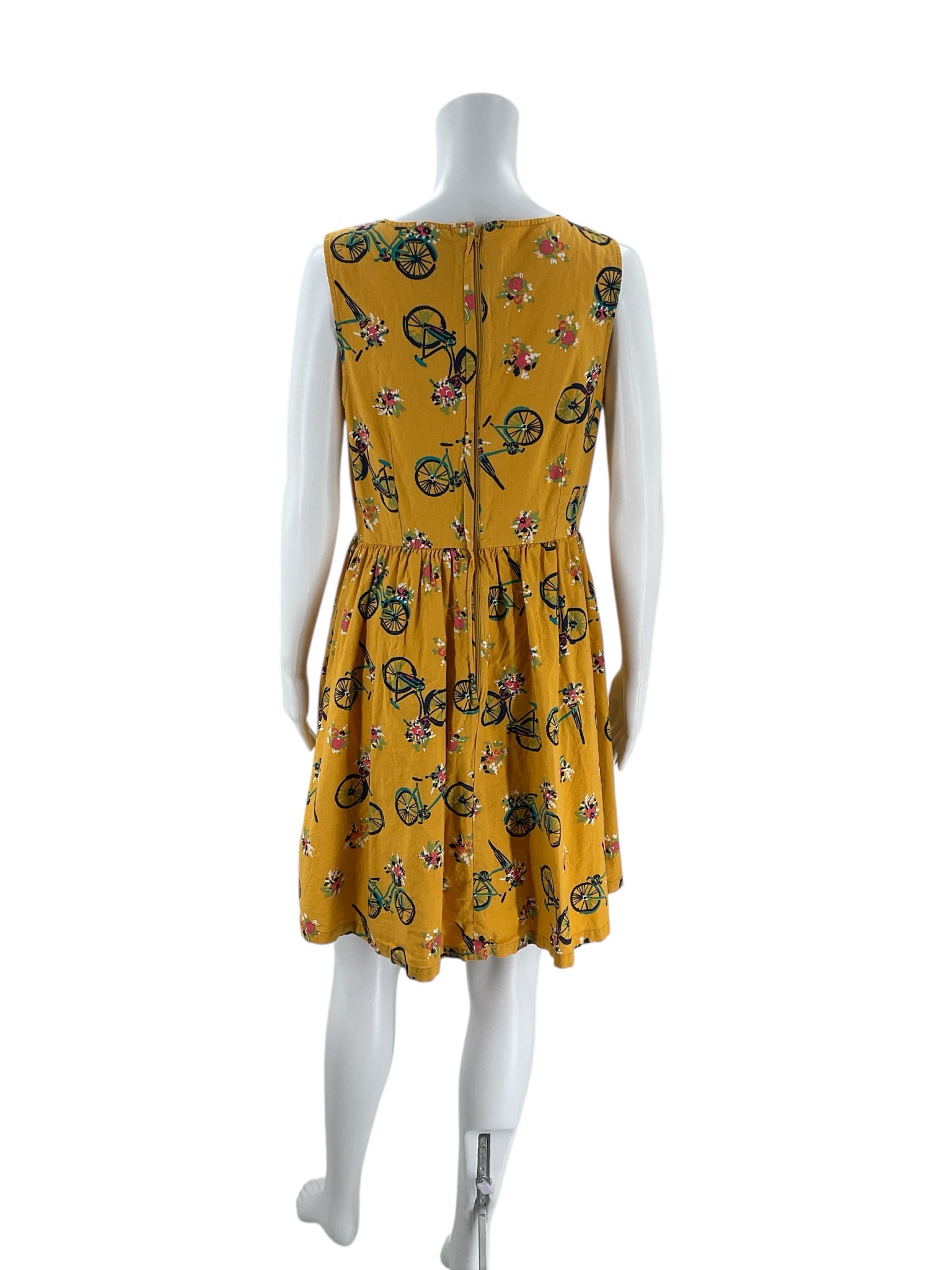 Back view of Modcloth Mustard/Multi Bike Dress - Size Large showing zipper closure and gathered waist, perfect for a relaxed, stylish look.