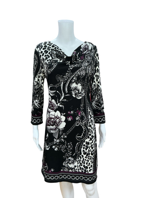 Pre-owned White House Black Market surplice sheath dress with floral and paisley border print, black and white knit fabric, size medium.