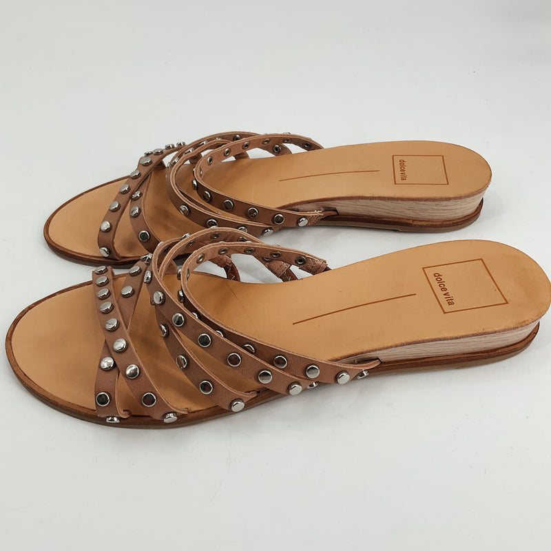 Dolce Vita Tan strap Pre-Owned Ladies Sandals - Size 9 with criss-cross leather straps and silver studs, flat bohemian slide design for casual wear.