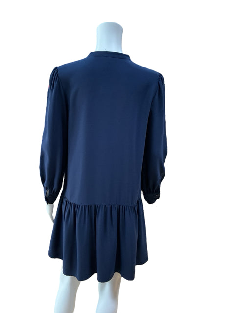 Back view of Halogen Navy Pre-Owned Ladies Dress - Size XXS Petite on mannequin, highlighting the tiered hem and relaxed tunic fit.