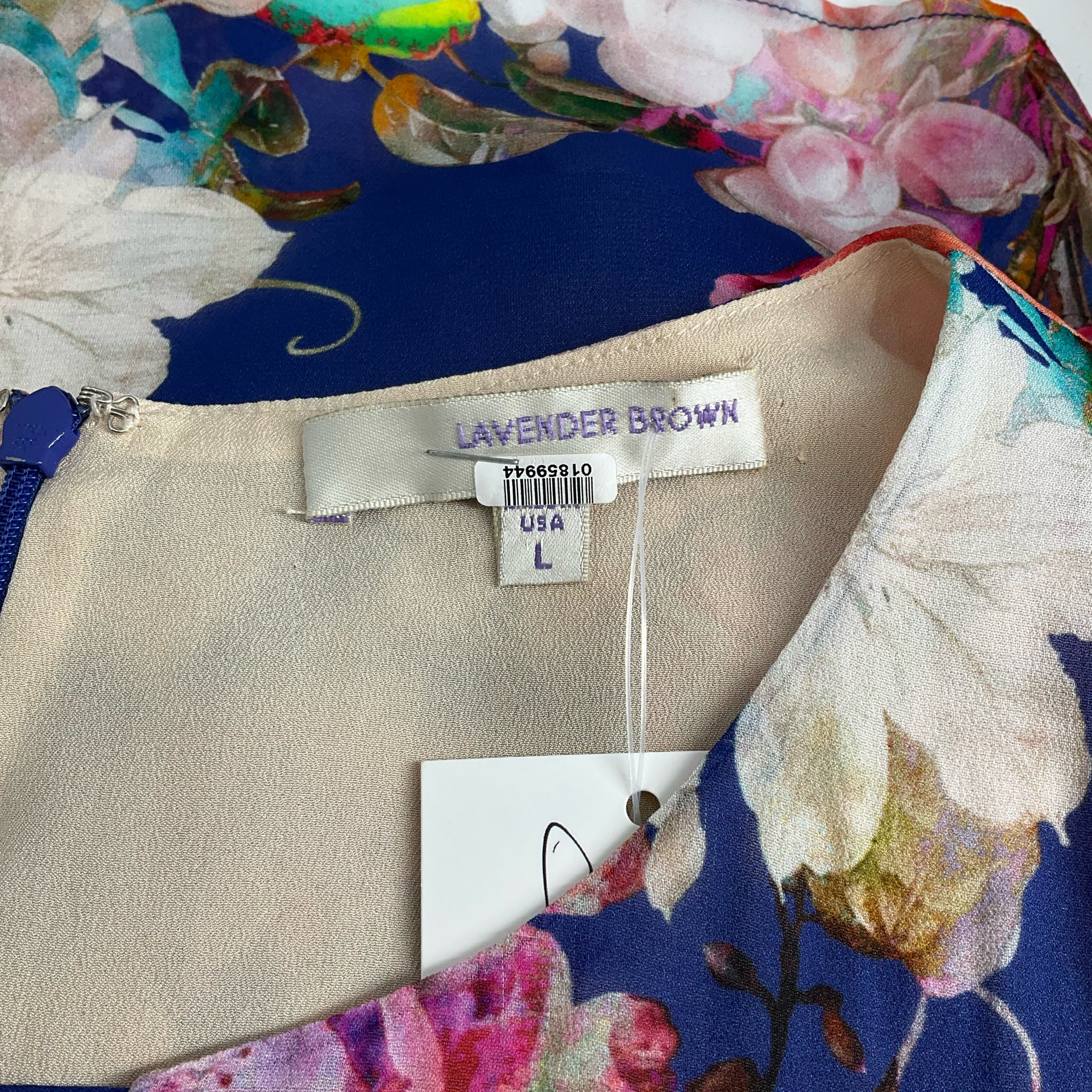 Close-up of Lavender Brown brand label on Blue/Multi Floral Dress - Size Large, confirming size and designer tag inside neckline.