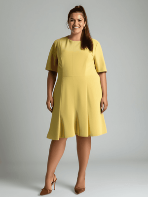 Donna Morgan Dress Size 14 in vibrant yellow, modeled with short sleeves and knee-length fit. Available at Margaret’s Fine Consignments.