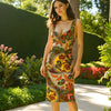 Model wearing David Meister sleeveless rainbow print dress size 10, fitted silhouette, vibrant colors, available at Margaret’s Fine Consignments.