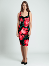 Trina Turk Scoop Neck Knee Dress Size 10 with bold pink and green floral print on black, modeled for Margaret’s Fine Consignments.