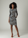 Model wearing J Mclaughlin Crew Neck Dress Size Large with black, blue, and tan paisley print, featuring 3/4 sleeves and mini length.