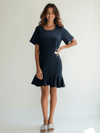 Sharagano Crew Neck Dress Size 10 modeled, featuring navy textured fabric and short sleeves, available at Margaret’s Fine Consignments.