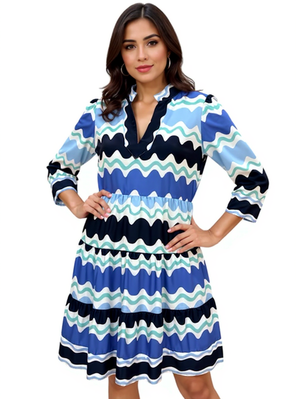 Sail to Sable Wave Stripe Ruffle Collar Tunic Dress in aqua, white, and navy with tiered mini silhouette, modeled in size Medium.