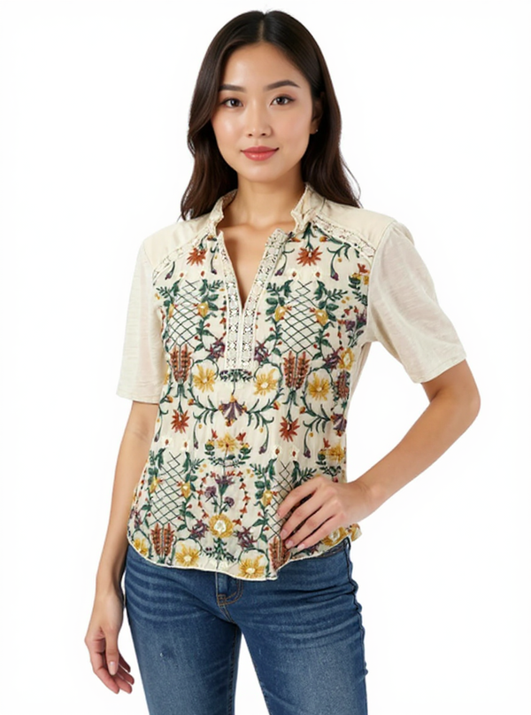 Tiny Cream/Multi Floral Pre-Owned Ladies Top in size XS, featuring colorful floral embroidery, short sleeves, and a v-neckline, styled casually.