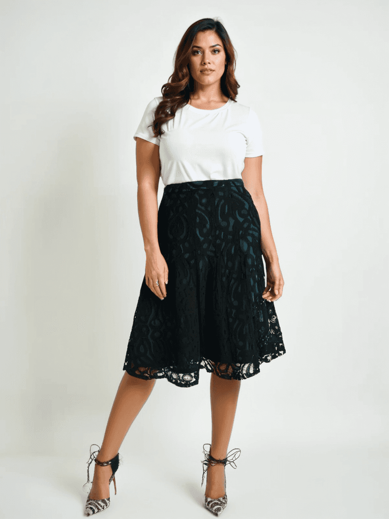 Model wearing Coldwater Creek Skirt Size 8 Petite in black and turquoise lace, available at Margaret's Fine Consignments. Elegant petite fit for chic styling.