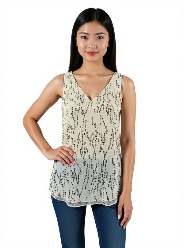 Pre-owned Lilly Pulitzer gold metallic silk cami top in size XS, modeled front view. Cream base with gold foil sparkle, ideal for parties.