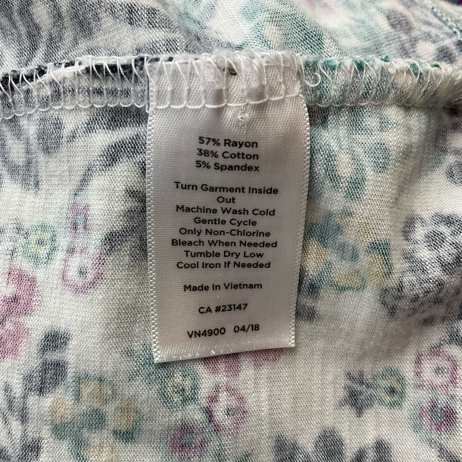 Talbots white and multi floral casual top for ladies, size large, featuring vibrant floral patterns and a relaxed fit.