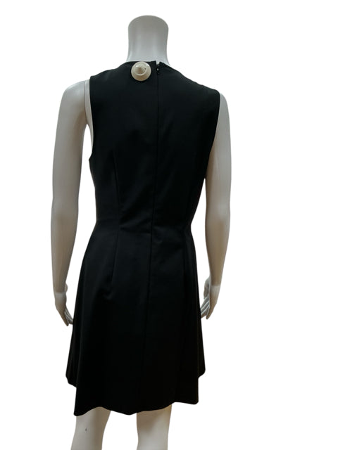 Back view of Sachin & Babi Black/White Floral Pre-Owned Ladies Dress - Size 8 featuring solid black A-line cut and hidden zipper closure.