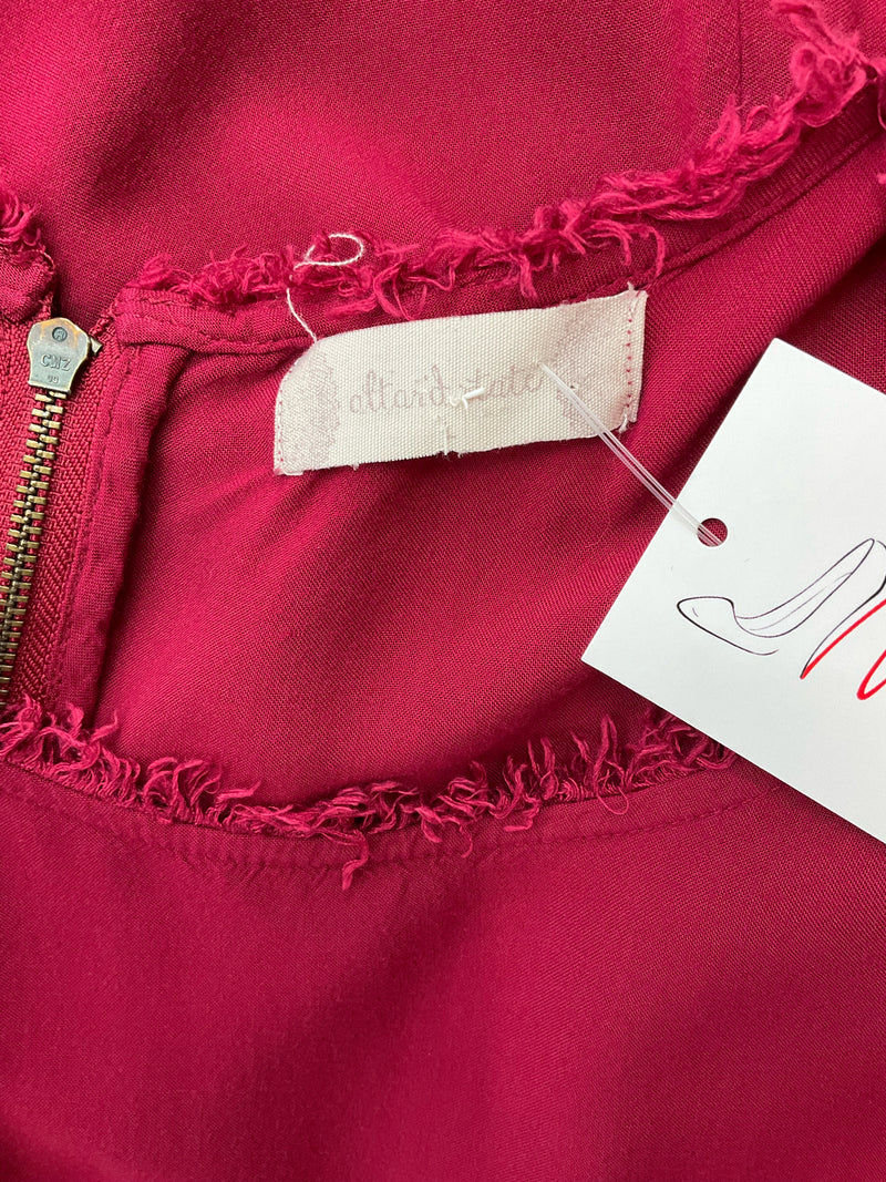 Close-up of Altar'd State brand label and zipper on burgundy rayon dress, showing raw edge neckline and pre-owned tag attached.