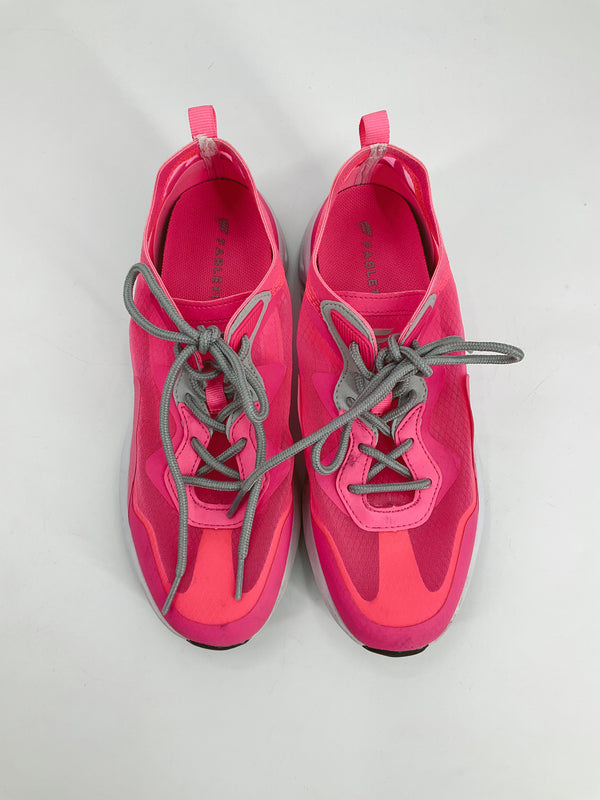 Top view of Fabletics pink pre-owned ladies sneakers size 8.5 featuring gray laces and vibrant pink mesh upper for sporty style.
