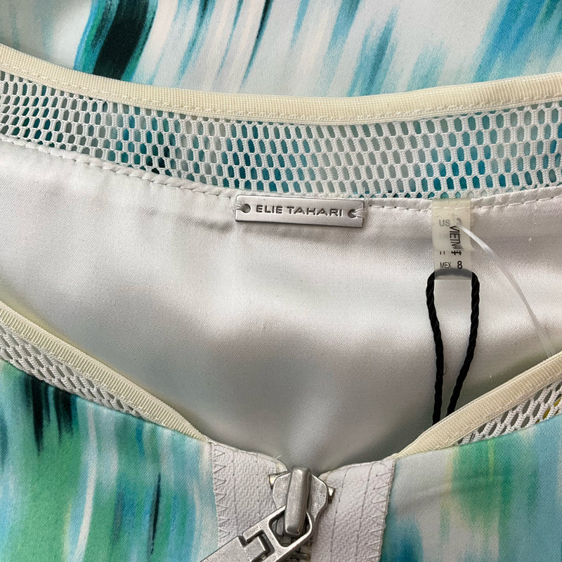 Close-up of Elie Tahari brand tag inside aqua print dress, size 8. Shows new with tags condition and quality satin lining.