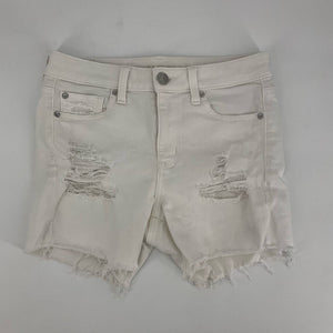 Front view of american eagle Size 4 White ripped Shorts with distressed detailing and frayed hems, ideal for casual summer wear.