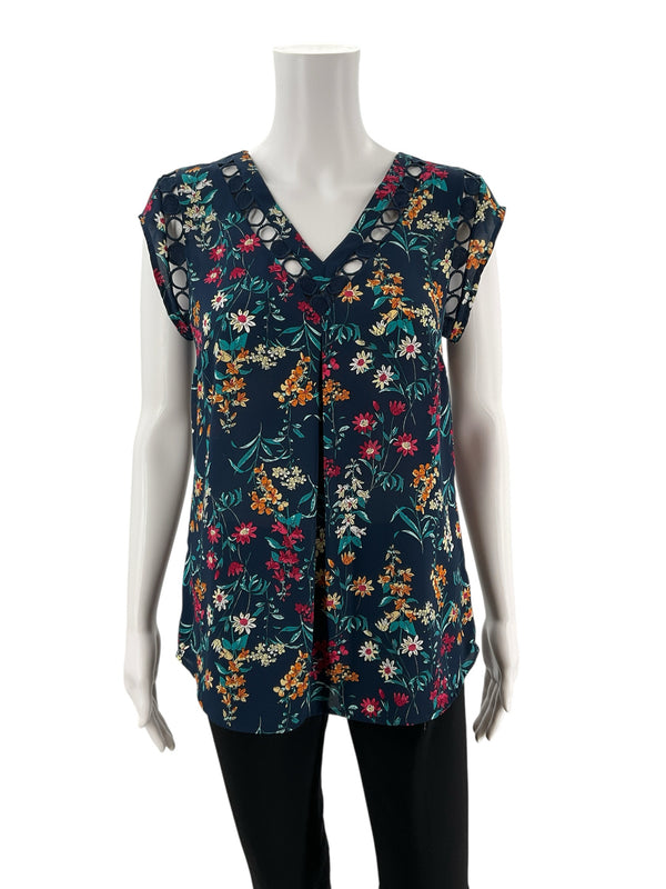 Front view of Daniel Rainn Floral Crochet Trim Sleeveless Blouse Top Size Small featuring V-neck, pleated front, and colorful floral pattern on navy background.