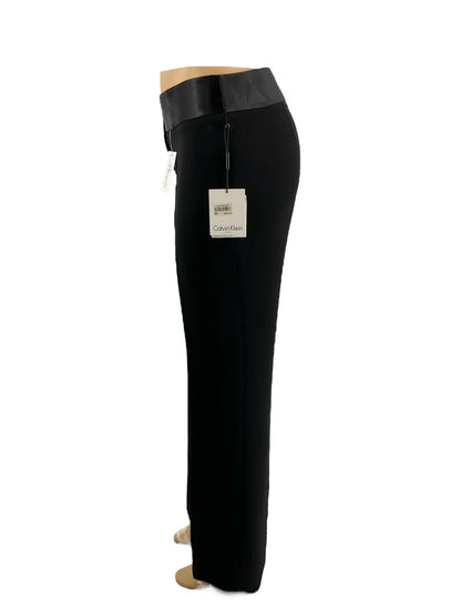 Calvin Klein black pre-owned ladies pants in size 8, showcasing a sleek design and tailored fit.