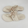 Tory Burch Size 10 off white flip flops sandals with gold logo medallion and textured leather straps, pre-owned women's footwear.