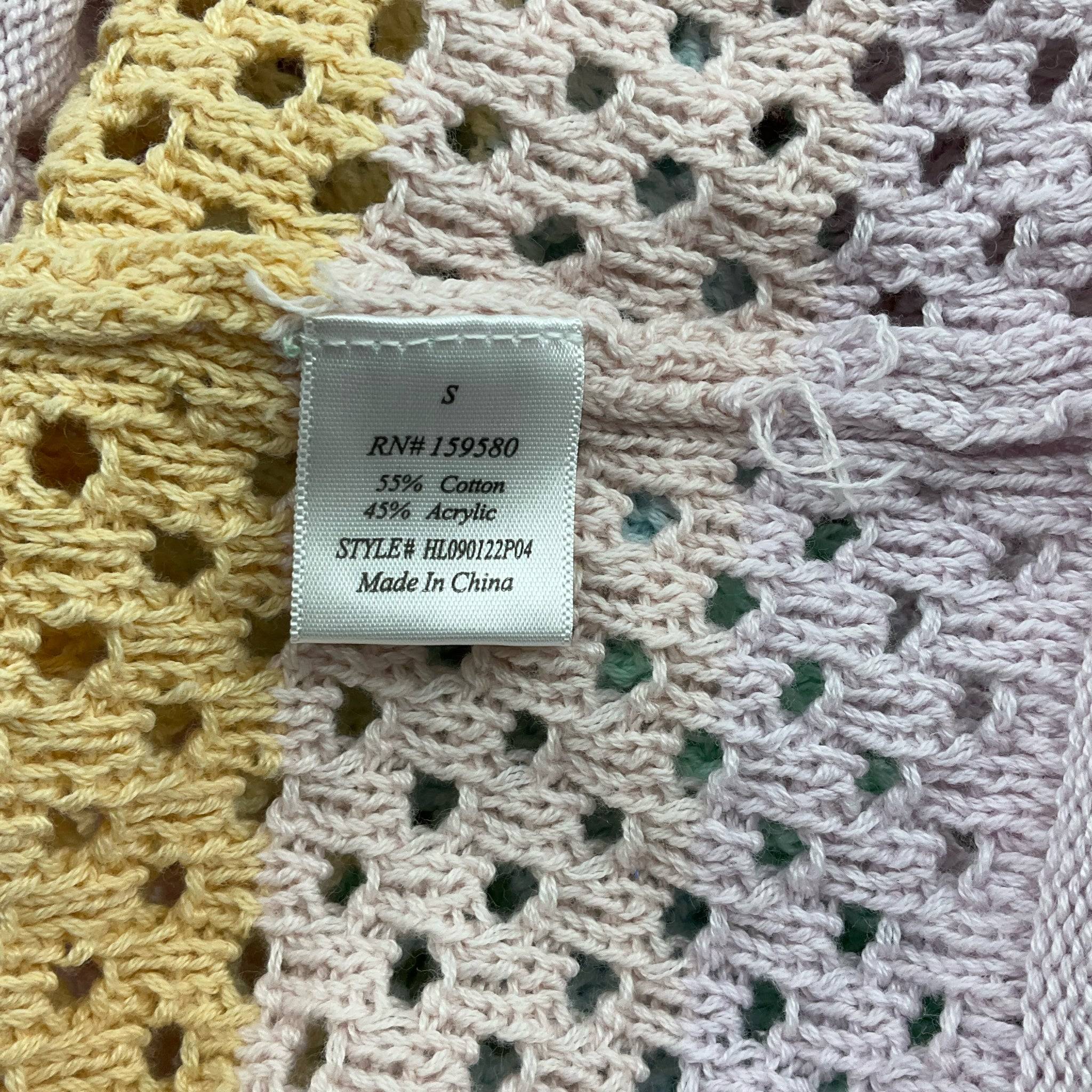 Fabric content label showing 55% cotton and 45% acrylic on Pink Lily size small rainbow sweater, style HL90122P04.