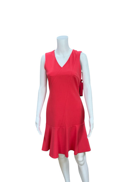 Front view of Calvin Klein Coral Pre-Owned Ladies Dress - Size 2 on mannequin, showcasing sheath silhouette with drop waist and ruffle hem.