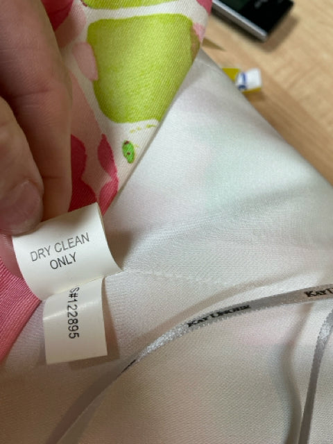 Care label of Kay Unger White/Green/Pink Print Pre-Owned Ladies Dress - Size 10 indicating dry clean only and style number 122895.
