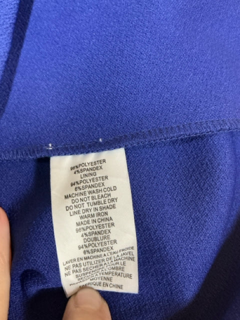 Fabric content label showing 94% polyester and 6% spandex blend for Trina Turk Blue Solid Pre-Owned Ladies Dress Size 8.