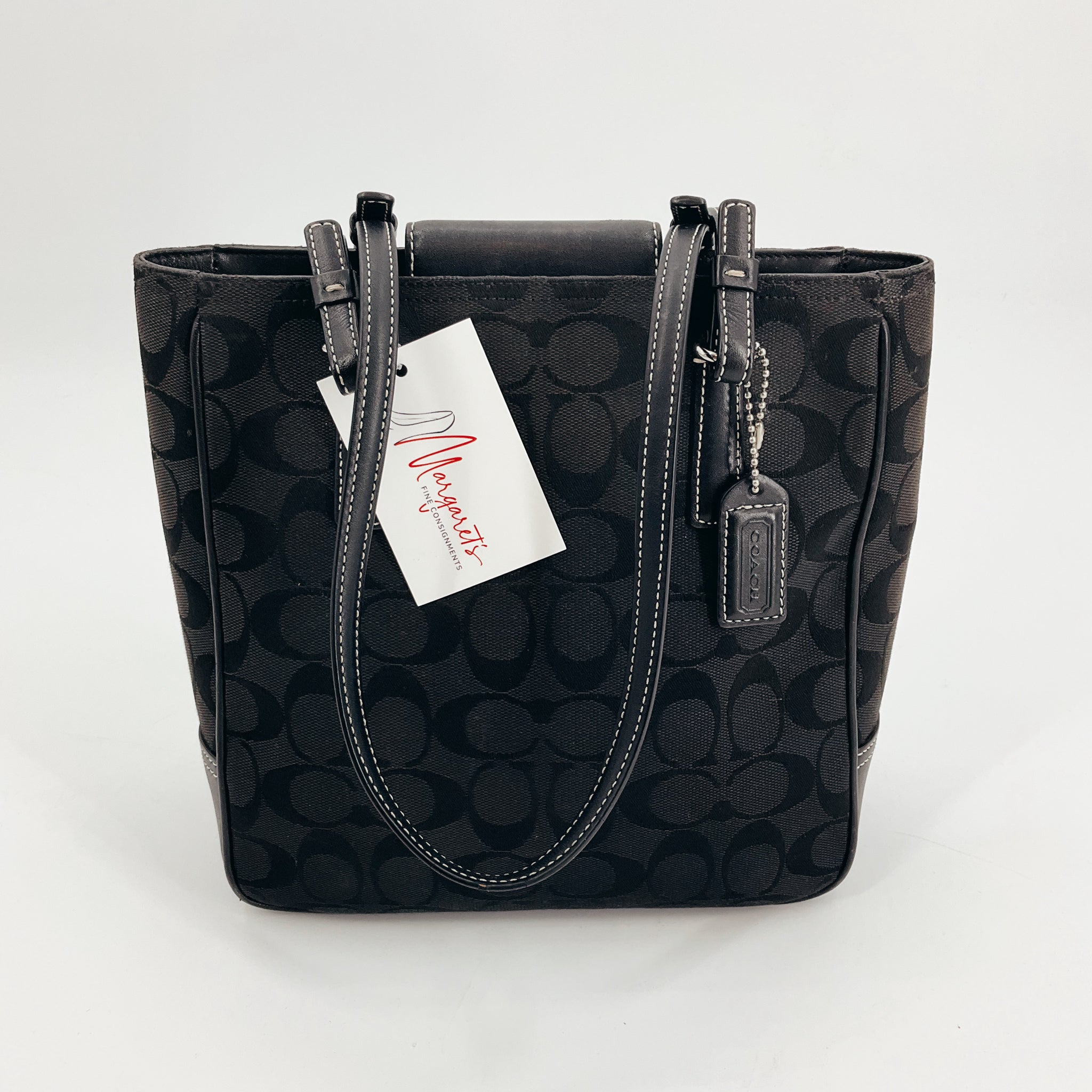 Pre-owned Coach Black Emblem Tote Bag featuring iconic monogram design and Coach leather tag, ideal for everyday and stylish use.